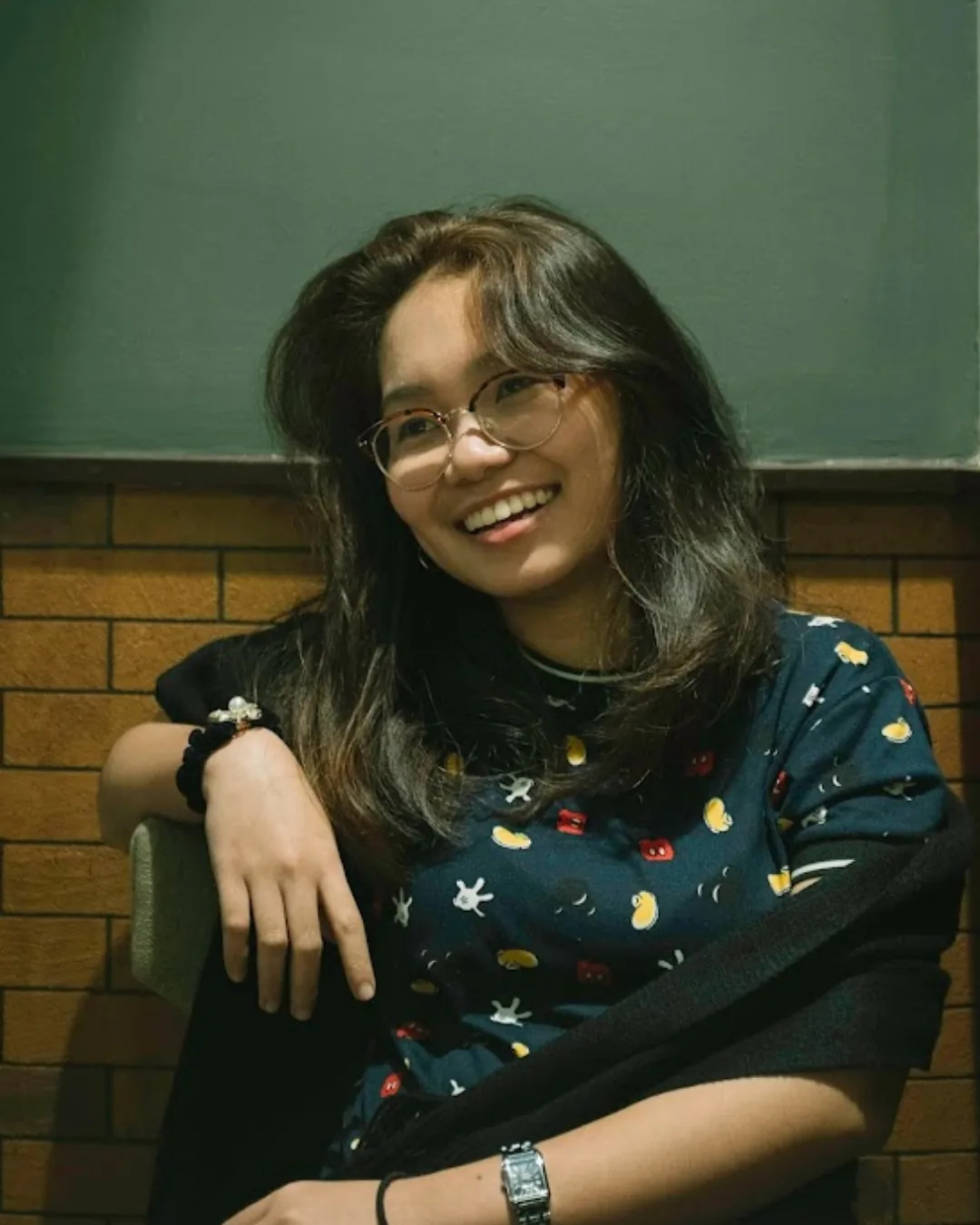 Maria Lina Losloso seated and smiling